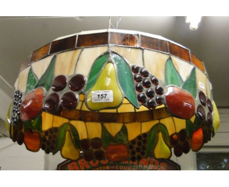 A large Tiffany style lead light lamp shade with design of fruit.