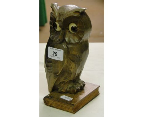 A Vintage carved wood owl clock with moving eyes.