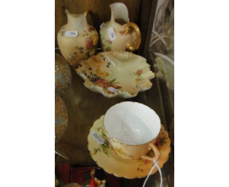 Royal Worcester shell, 2 Royal Worcester flatback jugs and a cup and saucer.