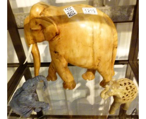 Shelf of elephants including wood and soapstone