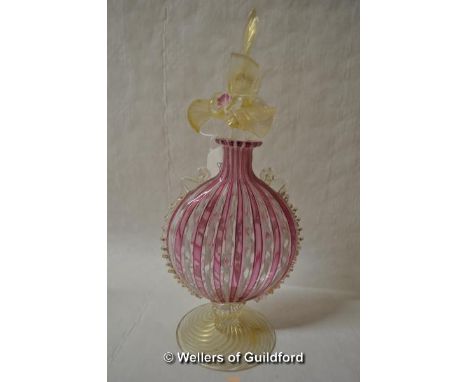 A Venetian Murano latticino moon flask, the cover formed as golden leaves with pink flowers, pink and white twist decoration,