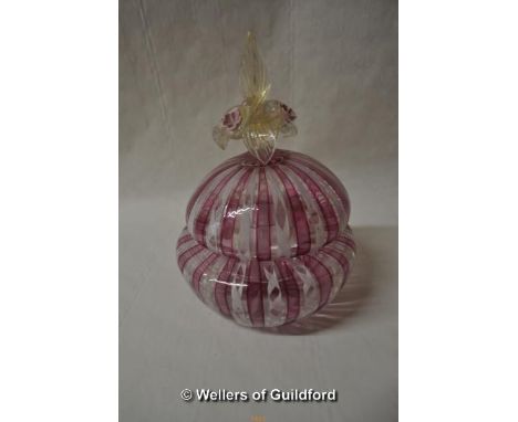 A Venetian Murano latticino pot and cover, the finial formed as pink flowers and golden leaves, 18cm.
