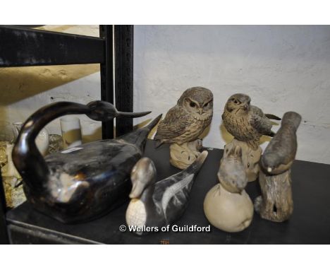 A studio pottery pintail duck, a large polished metal water bird, four Poole Pottery matt figurines of birds.
