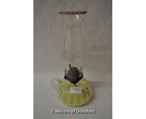 *A vaseline glass oil lamp with clear shade, 30cm. (Lot subject to VAT)