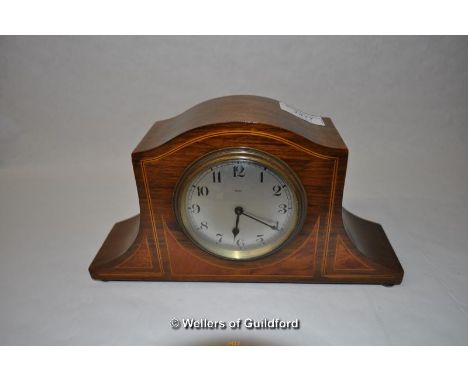 A small Edwardian mahogany mantel clock.