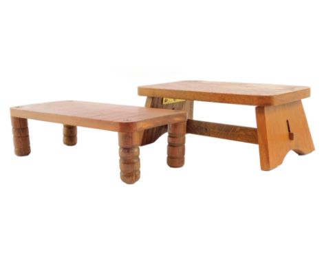 Two early 20thC wooden shop display stands, one of folding oak trestle form, 26cm wide, and a further stand, stamped to the u