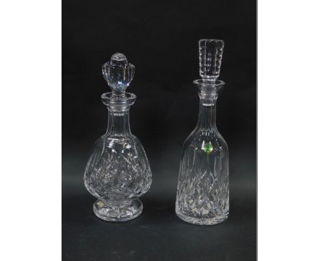 A Waterford crystal decanter and stopper decorated in the Lismore pattern, of mallet form, 34cm high, and a further decanter 