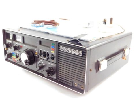 A Yaesu Musen Company Limited communications receiver, model FRG-7000, with instruction manual. 