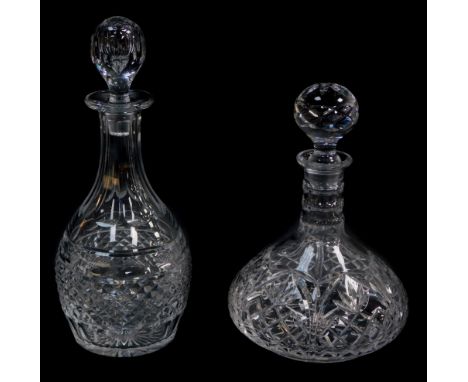 A heavy cut glass decanter, and stopper, 32.5cm high, together with a cut glass ships decanter and stopper, 26cm high. 