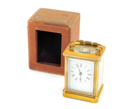 A brass carriage clock, rectangular enamel dial bearing Roman numerals, the case of conventional plain form, with leather out