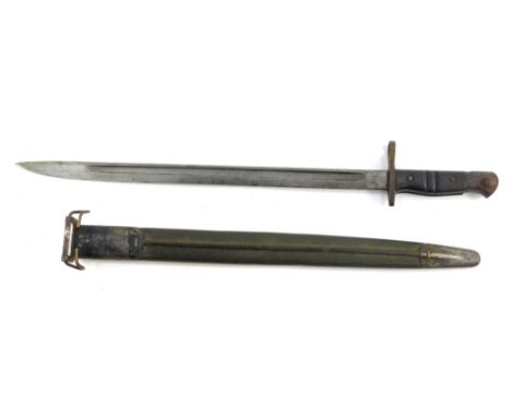 A British patent 1913 P.14 Enfield rifle bayonet, with a Remington steel blade, in a metal scabbard, 55cm wide. 