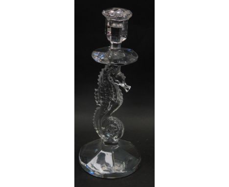 A Waterford crystal candlestick, raised on a seahorse shaped stem, over a circular base, 29cm high. 