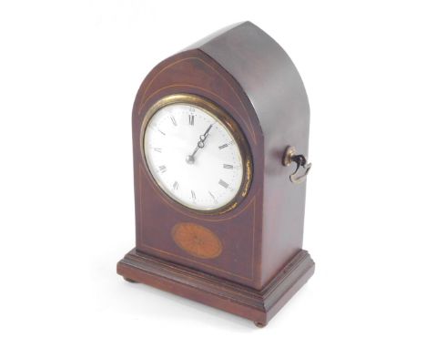 An Edwardian lancet mahogany inlaid mantel clock, circle enamelled dial bearing Roman and Arabic numerals, clockwork movement