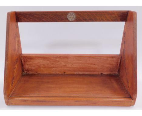 A church oak and plywood service book trough, bearing a circular plaque with coat of arms, 41.5cm wide. 