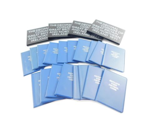 Four sets of decimal coinage of Great Britian and Northern Ireland 1971, cased, together with wallets containing Britains fir