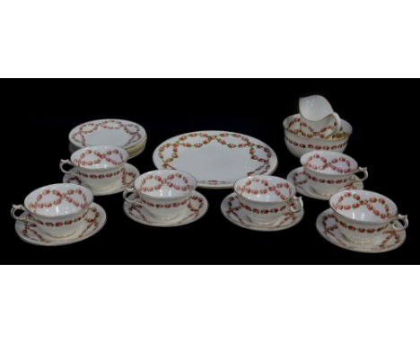 An early 20thC George Jones porcelain part tea service, decorated with garlands of roses, comprising bread plate, cream jug, 