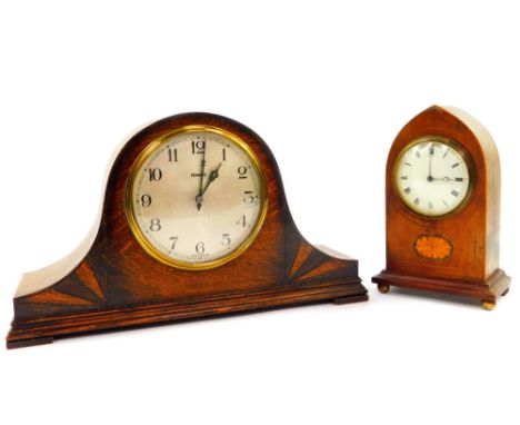 An Edwardian mahogany and inlaid mantel clock, circular enamel dial bearing Roman numerals, clockwork movement, the case of d