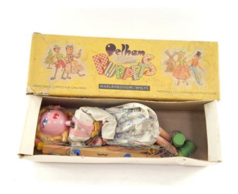 A mid 20thC Pelham puppet modelled as Gretel, of articulated form, partially painted, 30cm high.  (boxed, af)