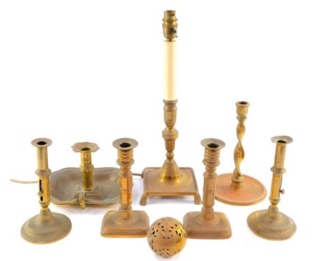 A 19thC and later brass candlesticks, a chamber stick, candlestick type table lamp and a brass pomander. (8)