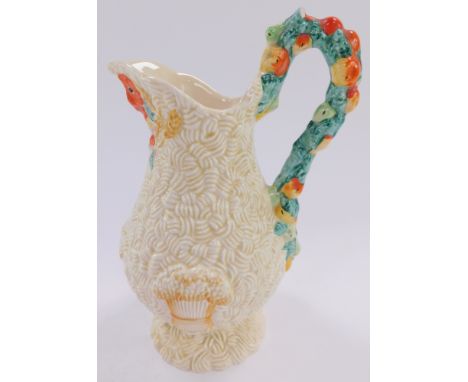 A Clarice Cliff pottery jug decorated in the Celtic Harvest pattern, of baluster form, printed and raised marks, 20cm high. (