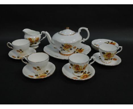 A Staffordshire mid century porcelain part tea service decorated with roses, comprising teapot, bread plate, cream jug, four 