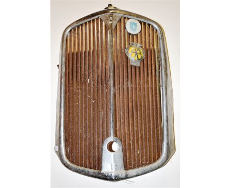 A 1939 ROVER 14 RADIATOR GRILL  the grill bearing an AA car badge and one other together with an Anglo-American Oil Esso lube