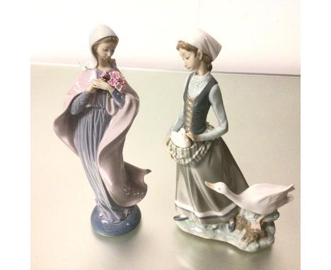 A Spanish Lladro porcelain figure, Woman with Gosling, decorated with polychrome enamels (32cm) and a figure with Cloak and B