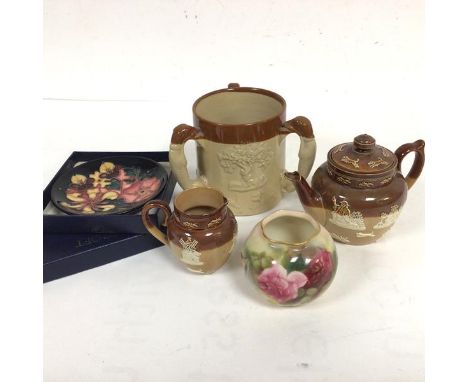 A Doulton Lambeth miniature teapot and milk jug with sprigged decoration (teapot: 11cm) and a stoneware three handled hunting