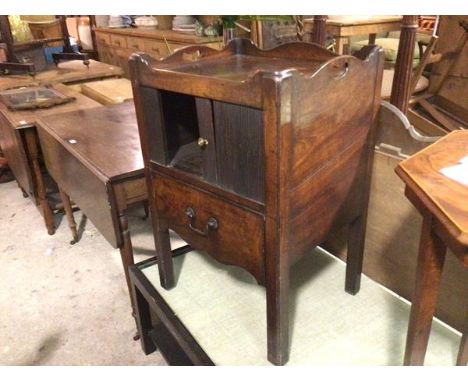 A George III mahogany tray top bedside commode, with tambour front (a/f) and scalloped single drawer, raised on square fluted