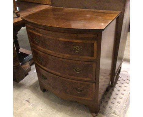 A mahogany reproduction bow front batchelor's style chest, with pull out slide above a satinwood and walnut inlaid set of thr