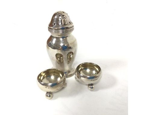 A pair of London silver circular cauldron style salts raised on bun feet (3cm x 5cm) and a London silver dome top sugar casto