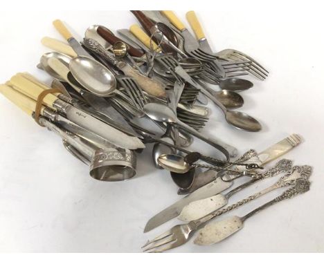 A Continental silver bladed mother of pearl handled fruit knives, two Chester silver butter knives, miscellaneous spoons, Epn