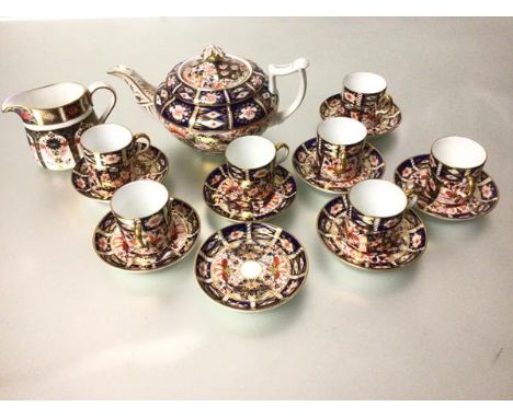 A Duesbury Derby 19thc squat teapot decorated with Imari style design and a sixteen piece Royal Crown Derby coffee set decora