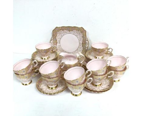 A thirty eight piece Tuscan china pink, gold and floral enamelled bordered tea service
