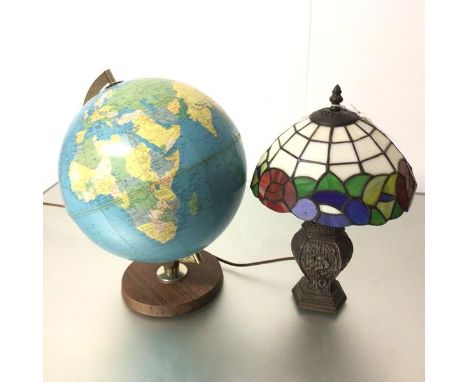 A 1970s teak based terrestrial globe and a bronzed style metal Tiffany style lamp (globe: 41cm. lamp: 39cm) (2)