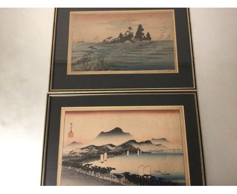 A pair of Japanese woodblock prints, highlighted with wash one depicting Seascapes the other with Sailboats, in gilt glazed f