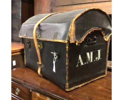 An Edwardian M Cleghorn, Portmanteau and Trunk Manufacturers, Edinburgh, canvas and leather mounted dome top trunk with cast 