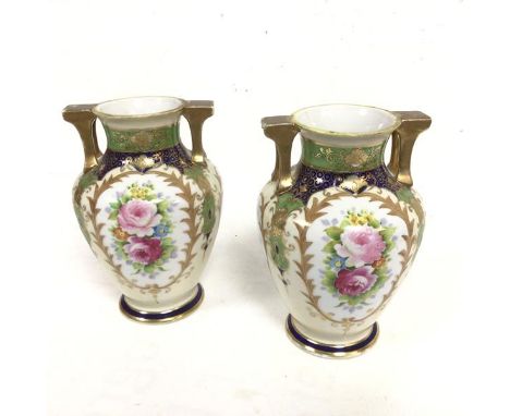 A pair of Noritake Worcester style baluster two handled vases decorated with handpainted floral sprays and gilt reserves (19c