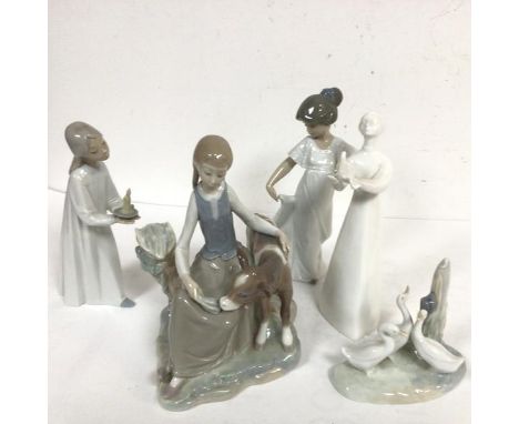 A Lladro Spanish porcelain figure group, Girl with a Calf, a Nao style Girl with Candle, a Nao figure, Girl in Nightdress, a 