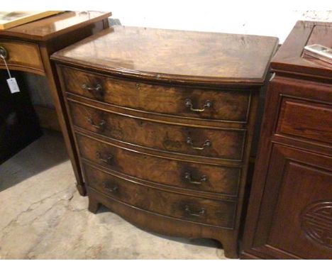 A reproduction walnut bow front chest fitted four graduated long drawers, with shaped apron, on splay bracket feet (79cm x 73