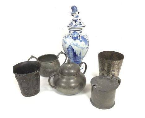A pewter Arts &amp; Crafts style beaker with three leaf clover design, a two handled sugar basin with cover and  another, a d