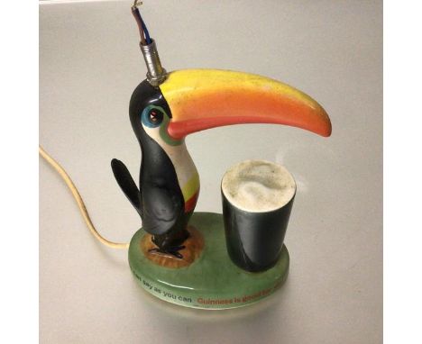 A 1950s/60s Carltonware handpainted Guiness is Good for You... how grand to be a Tucan figure lamp (missing shade) (22cm. bas
