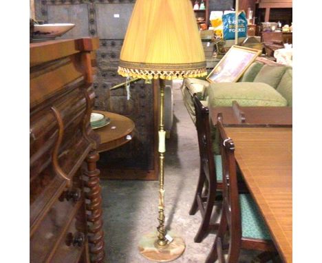 A mid century onyx and brass panelled floor lamp on circular onyx base, complete with original orange pleated and fringed sha