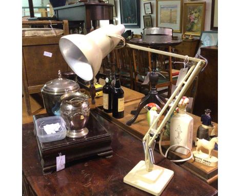 A 1950s cream enamelled anglepoise lamp, raised on stepped base (extended: 95cm base: 15cm)