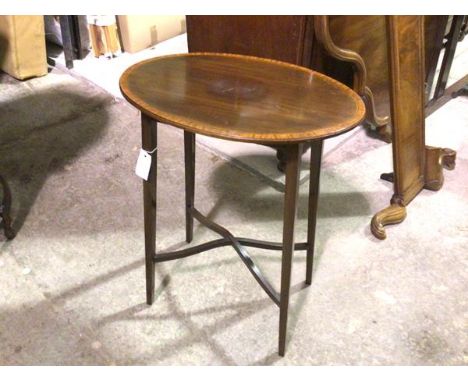 An Edwardian mahogany oval inlaid occasional table raised on square tapered splay supports united by stretcher (73cm x 53cm x