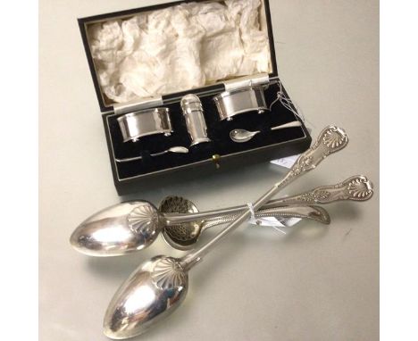 An Epns three piece condiment set, a set of six pairs of Epns fish knives and forks, a pair of Epns fiddle and shell pattern 
