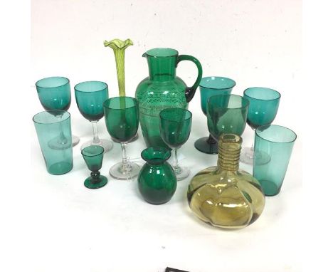 A collection of six various green cordial glasses, two green tumblers, a green and gilt decorated ewer, a vaseline glass styl