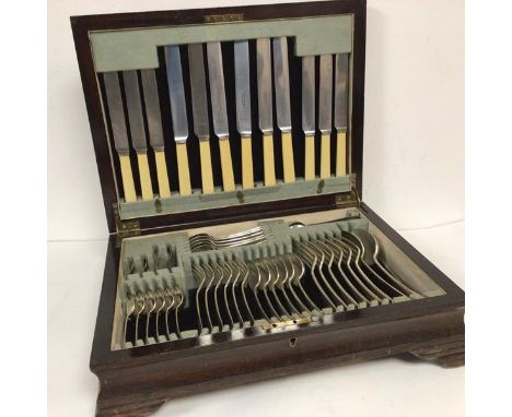 An Epns Old English pattern table canteen containing six table knives, six side knives, six table forks, six dessert forks, s