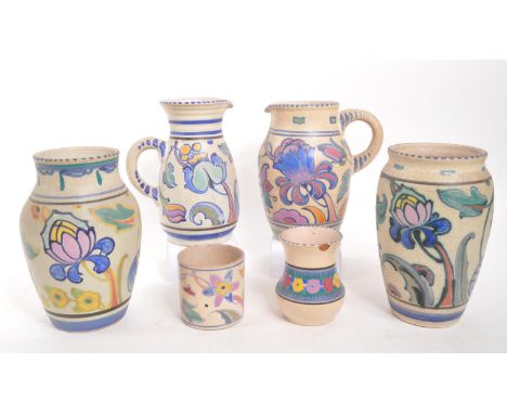 A collection of vintage 20th century Honiton, Devon stoneware pottery jugs and vases. Hand painted, with floral and foliate d