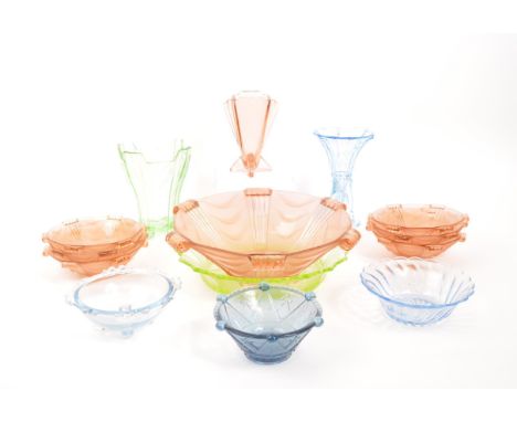 A collection of 20th Century coloured Art Deco glass item. Comprising of pink centre piece bowl with matching set of smaller 
